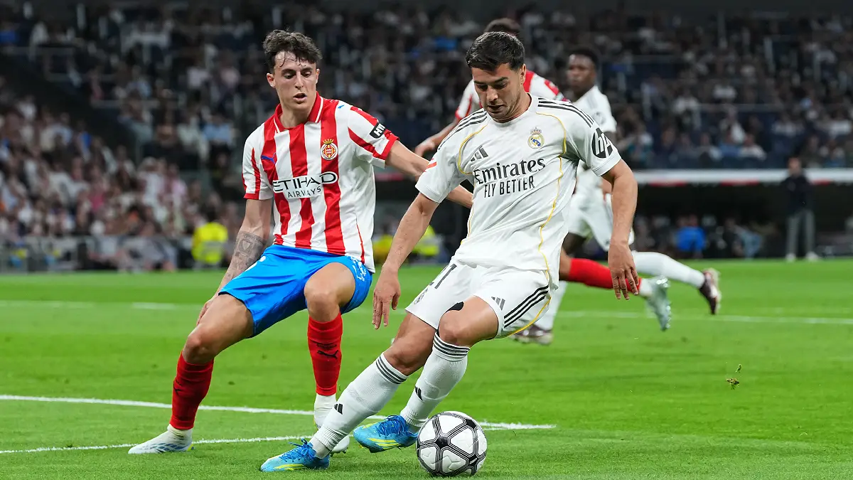 MADRID, SPAIN - APRIL 10: Brahim Diaz of Real Madrid controls the ball while under pressure from Alejandro Frances of Girona FC during the LaLiga EA Sports match between Real Madrid CF and Girona FC at Estadio Santiago Bernabeu on April 10, 2026 in Madrid, Spain. (Photo by Angel Martinez/Getty Images)