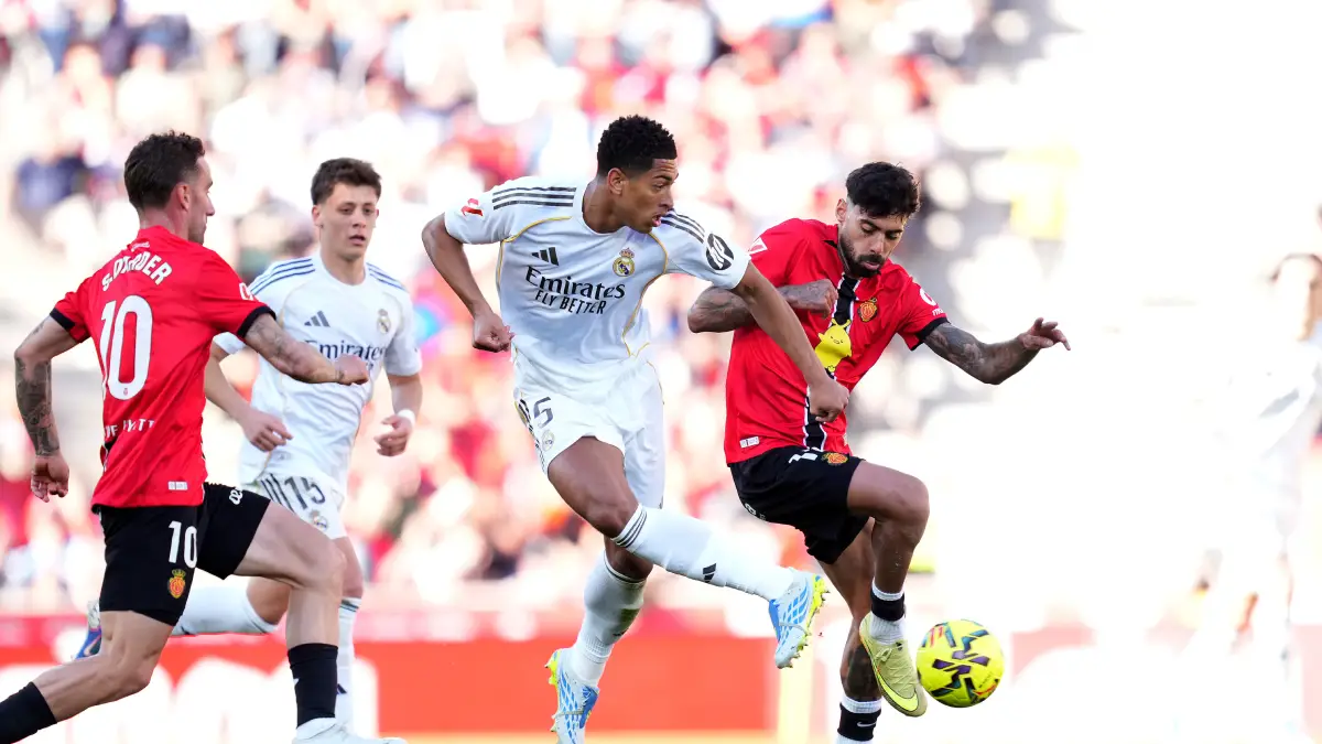 MALLORCA, SPAIN - APRIL 04: Jude Bellingham of Real Madrid is challenged by Samu Costa of RCD Mallorca during the LaLiga EA Sports match between RCD Mallorca and Real Madrid CF at Estadio Daredevil Son Moix on April 04, 2026 in Mallorca, Spain. (Photo by Alex Caparros/Getty Images)