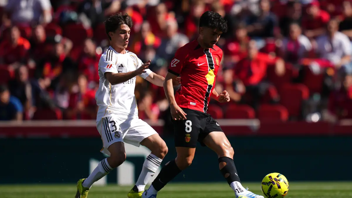 MALLORCA, SPAIN - APRIL 04: Manu Morlanes of RCD Mallorca is challenged by Manuel Angel of Real Madrid during the LaLiga EA Sports match between RCD Mallorca and Real Madrid CF at Estadio Daredevil Son Moix on April 04, 2026 in Mallorca, Spain. (Photo by Alex Caparros/Getty Images)
