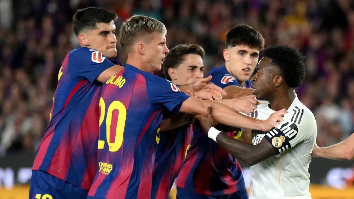 BARCELONA, SPAIN - MAY 10: Vinicius Junior of Real Madrid clashes with Gavi, Pau Cubarsi, Dani Olmo and Gerard Martin of FC Barcelona during the LaLiga EA Sports match between FC Barcelona and Real Madrid CF at Spotify Camp Nou on May 10, 2026 in Barcelona, Spain. (Photo by David Ramos/Getty Images)