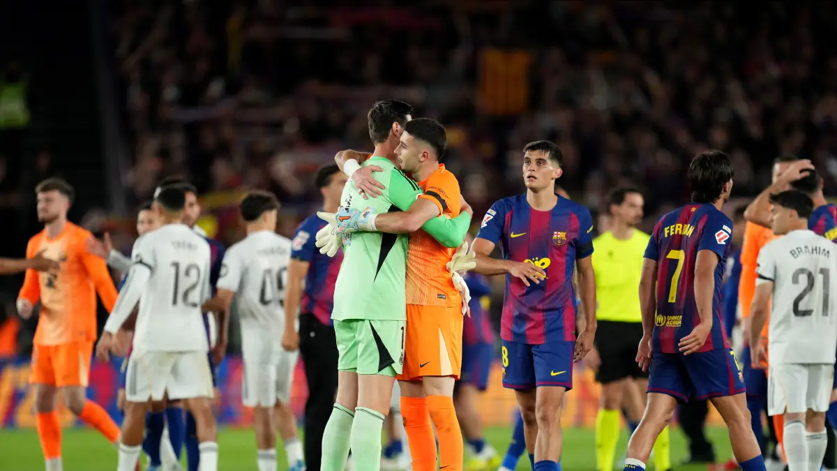 BARCELONA, SPAIN - MAY 10: Thibaut Courtois of Real Madrid embraces Joan Garcia of FC Barcelona after FC Barcelona defeat Real Madrid, and win the LaLiga title, after the LaLiga EA Sports match between FC Barcelona and Real Madrid CF at Spotify Camp Nou on May 10, 2026 in Barcelona, Spain. (Photo by Alex Caparros/Getty Images)