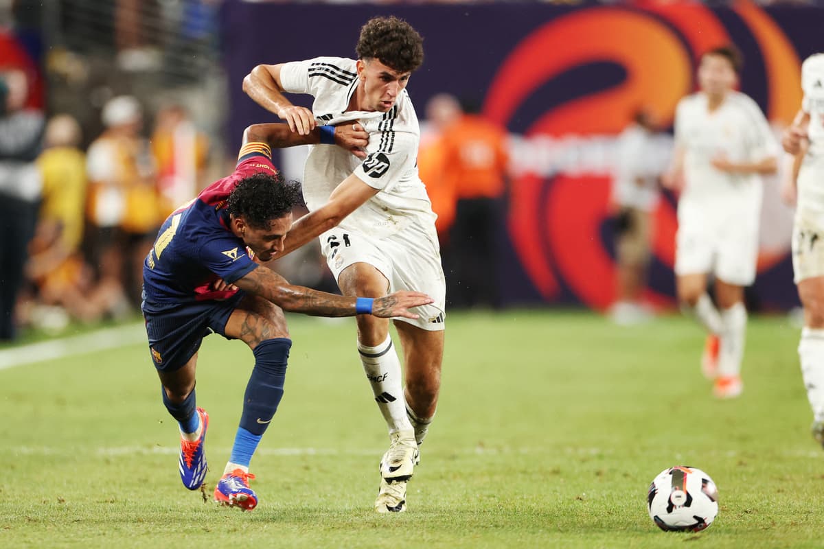 Barcelona's Brazilian forward #11 Raphinha (L) vies for the ball with Real Madrid's Spanish defender #31 Jacobo Ramon Naveros (R) during the pre-season club friendly football match between Real Madrid and Barcelona at MetLife Stadium in East Rutherford, New Jersey, August 3, 2024. (Photo by Charly TRIBALLEAU / AFP) (Photo by CHARLY TRIBALLEAU/AFP via Getty Images)