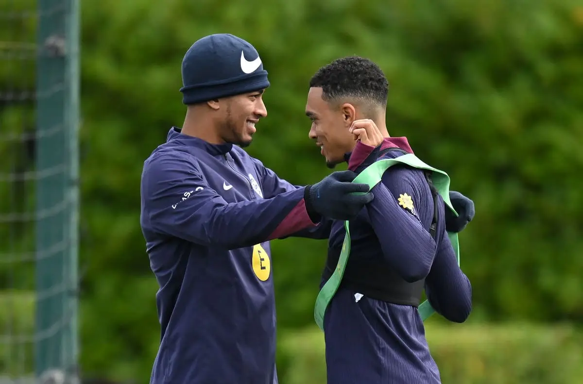 ENFIELD, ENGLAND - OCTOBER 12: Jude Bellingham and Trent Alexander-Arnold of England interact during a training session at Tottenham Hotspur Training Centre on October 12, 2024 in Enfield, England. (Photo by Harry Murphy/Getty Images)