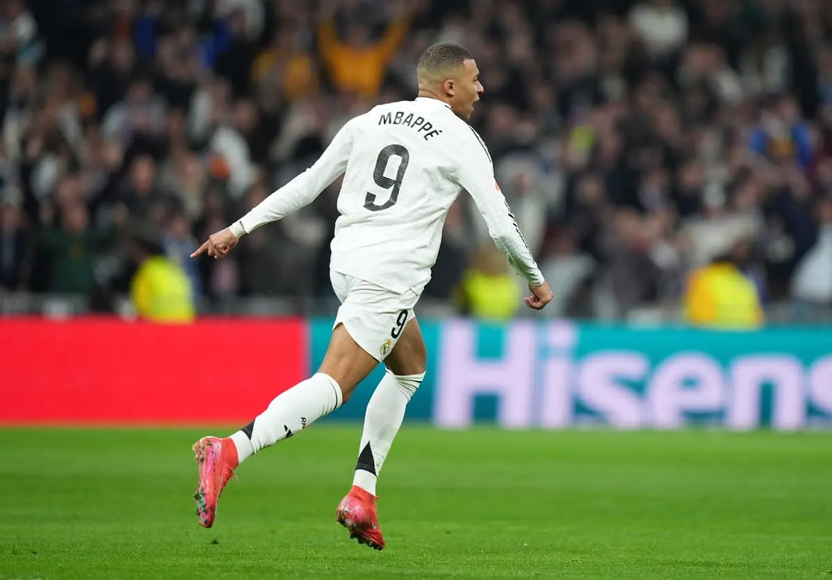 MADRID, SPAIN - FEBRUARY 08: Kylian Mbappe of Real Madrid celebrates scoring his team's first goal during the LaLiga match between Real Madrid CF and Atletico de Madrid at Estadio Santiago Bernabeu on February 08, 2025 in Madrid, Spain. (Photo by Angel Martinez/Getty Images).