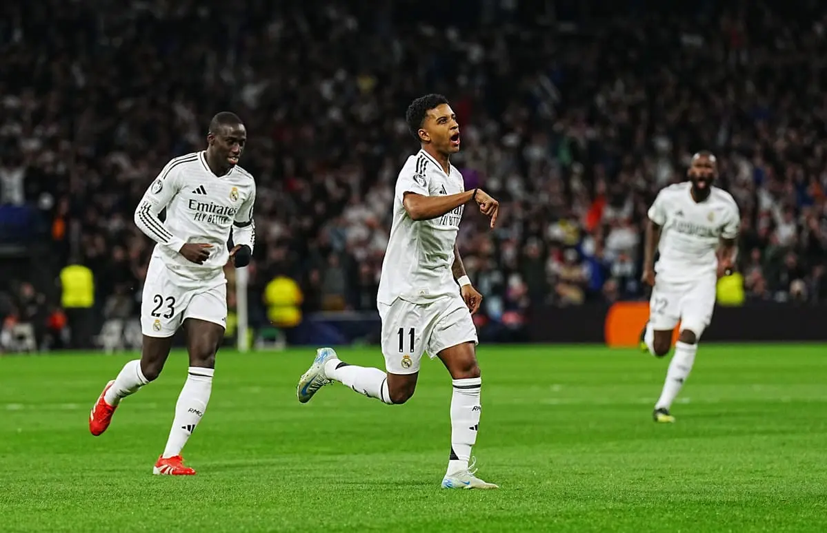 MADRID, SPAIN - MARCH 04: Rodrygo of Real Madrid celebrates scoring his team's first goal during the UEFA Champions League 2024/25 Round of 16 first leg match between Real Madrid C.F. and Atletico de Madrid at Santiago Bernabeu Stadium on March 04, 2025 in Madrid, Spain. (Photo by Aitor Alcalde/Getty Images)