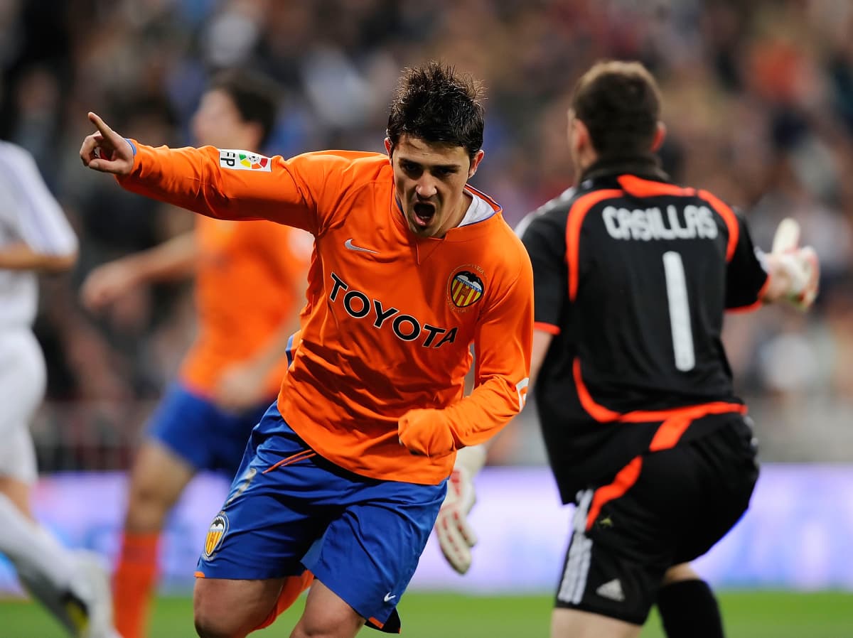 MADRID, SPAIN - MARCH 23: David Villa of Valence celebrates after scoring his team's opening goal during the La Liga match between Real Madrid and Valencia at the Santiago Bernabeu stadium on March 23, 2008 in Madrid, Spain. (Photo by Denis Doyle/Getty Images)
