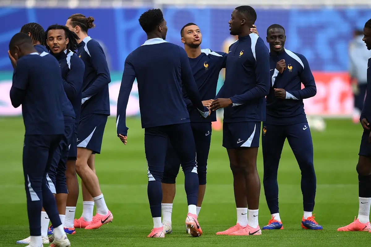 HAMBURG, GERMANY - JULY 04: Kylian Mbappe of France speaks with Ibrahima Konate of France during a France training session ahead of their UEFA EURO 2024 quarter final match against Portugal at Volksparkstadion on July 04, 2024 in Hamburg, Germany. (Photo by Justin Setterfield/Getty Images)