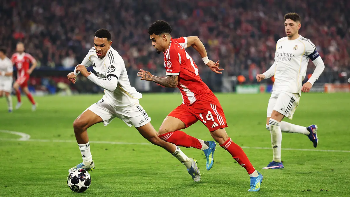 MUNICH, GERMANY - APRIL 15: Luis Diaz of Bayern Munich is challenged by rma12 during the UEFA Champions League 2025/26 Quarter-Final Second Leg match between FC Bayern München and Real Madrid CF at Football Arena Munich on April 15, 2026 in Munich, Germany. (Photo by Adam Pretty/Getty Images)