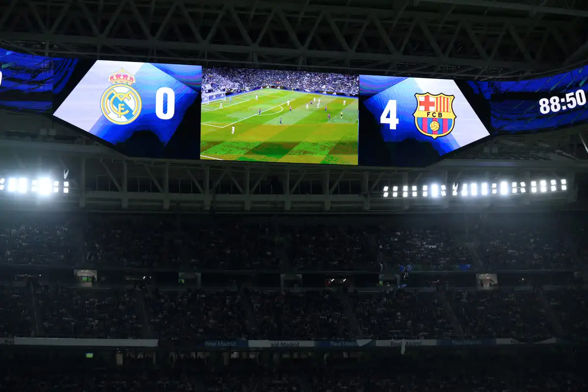 MADRID, SPAIN - OCTOBER 26: LED screens inside the stadium display the final score of Real Madrid 0 and FC Barcelona 4 following the LaLiga match between Real Madrid CF and FC Barcelona at Estadio Santiago Bernabeu on October 26, 2024 in Madrid, Spain. (Photo by David Ramos/Getty Images) Clásico