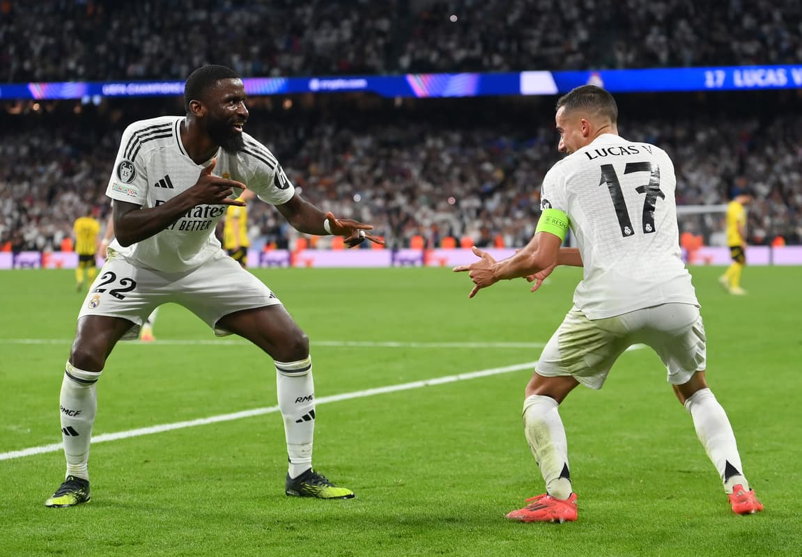MADRID, SPAIN - OCTOBER 22: Lucas Vazquez of Real Madrid celebrates with teammate Antonio Ruediger after scoring his team's third goal during the UEFA Champions League 2024/25 League Phase MD3 match between Real Madrid C.F. and Borussia Dortmund at Estadio Santiago Bernabeu on October 22, 2024 in Madrid, Spain. (Photo by Denis Doyle/Getty Images)