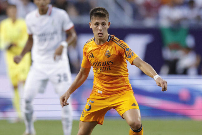 Real Madrid's midfielder #15 Arda Guler controls the ball during the first half of the pre-season club friendly football match between AC Milan and Real Madrid at Soldier Field in Chicago, Illinois, on July 31 2024. (Photo by KAMIL KRZACZYNSKI / AFP) (Photo by KAMIL KRZACZYNSKI/AFP via Getty Images)