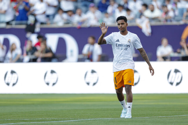 Real Madrid's forward #11 Rodrygo waves to fans as he warms up before the pre-season club friendly football match between AC Milan and Real Madrid at Soldier Field in Chicago, Illinois, on July 31, 2024. (Photo by KAMIL KRZACZYNSKI / AFP) (Photo by KAMIL KRZACZYNSKI/AFP via Getty Images)