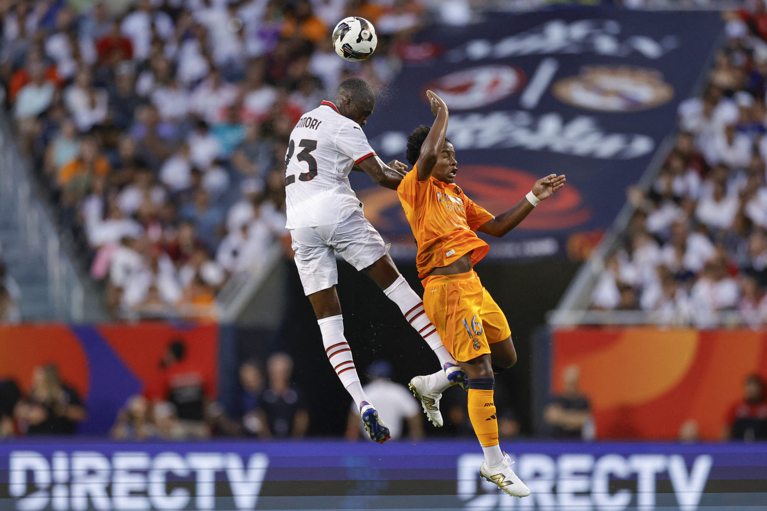 AC Milan's English defender #23 Fikayo Tomori (L) goes for a header against Real Madrid's Brazilian forward #16 Endrick (R) during the first half of pre-season club friendly football match between AC Milan and Real Madrid at Soldier Field in Chicago, Illinois, on July 31, 2024. (Photo by KAMIL KRZACZYNSKI / AFP) (Photo by KAMIL KRZACZYNSKI/AFP via Getty Images)