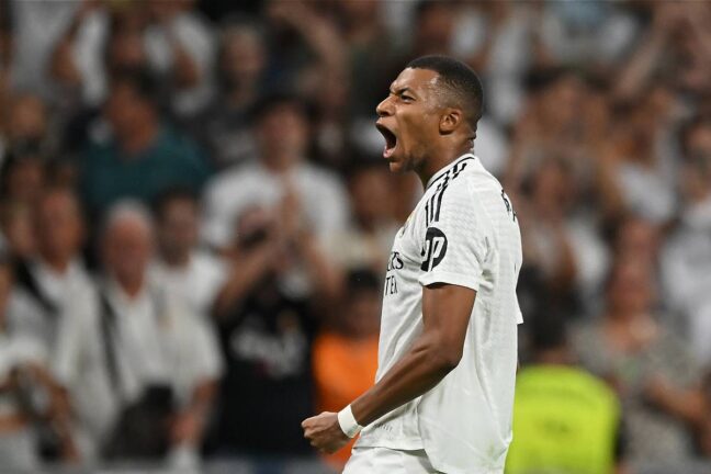 Mbappé célébrant son second but face au Betis avec le Real Madrid (Photo by Denis Doyle/Getty Images).