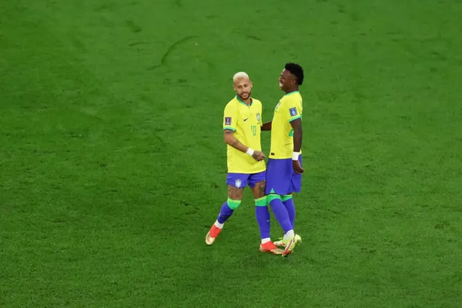 Neymar (L) and Vinicius Junior of Brazil react during the FIFA World Cup Qatar 2022 quarter final match between Croatia and Brazil at Education City Stadium on December 09, 2022 in Al Rayyan, Qatar. (Photo by Francois Nel/Getty Images)