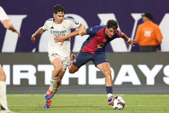 Real Madrid's Spanish midfielder #28 Mario Martin (L) vies for the ball with Barcelona's Spanish midfielder #07 Guille Fernández (R) during the pre-season club friendly football match between Real Madrid and Barcelona at MetLife Stadium in East Rutherford, New Jersey, August 3, 2024. (Photo by Charly TRIBALLEAU / AFP) (Photo by CHARLY TRIBALLEAU/AFP via Getty Images)