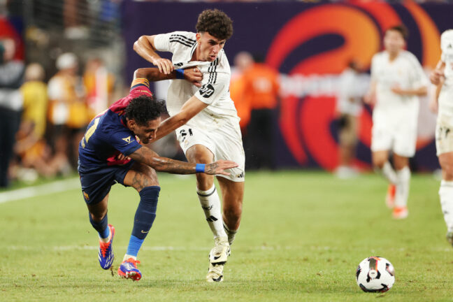Barcelona's Brazilian forward #11 Raphinha (L) vies for the ball with Real Madrid's Spanish defender #31 Jacobo Ramon Naveros (R) during the pre-season club friendly football match between Real Madrid and Barcelona at MetLife Stadium in East Rutherford, New Jersey, August 3, 2024. (Photo by Charly TRIBALLEAU / AFP) (Photo by CHARLY TRIBALLEAU/AFP via Getty Images)