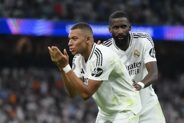 MADRID, SPAIN - SEPTEMBER 17: Kylian Mbappe of Real Madrid celebrates scoring his team's first goal during the UEFA Champions League 2024/25 League Phase MD1 match between Real Madrid CF and VfB Stuttgart at Estadio Santiago Bernabeu on September 17, 2024 in Madrid, Spain. (Photo by David Ramos/Getty Images)