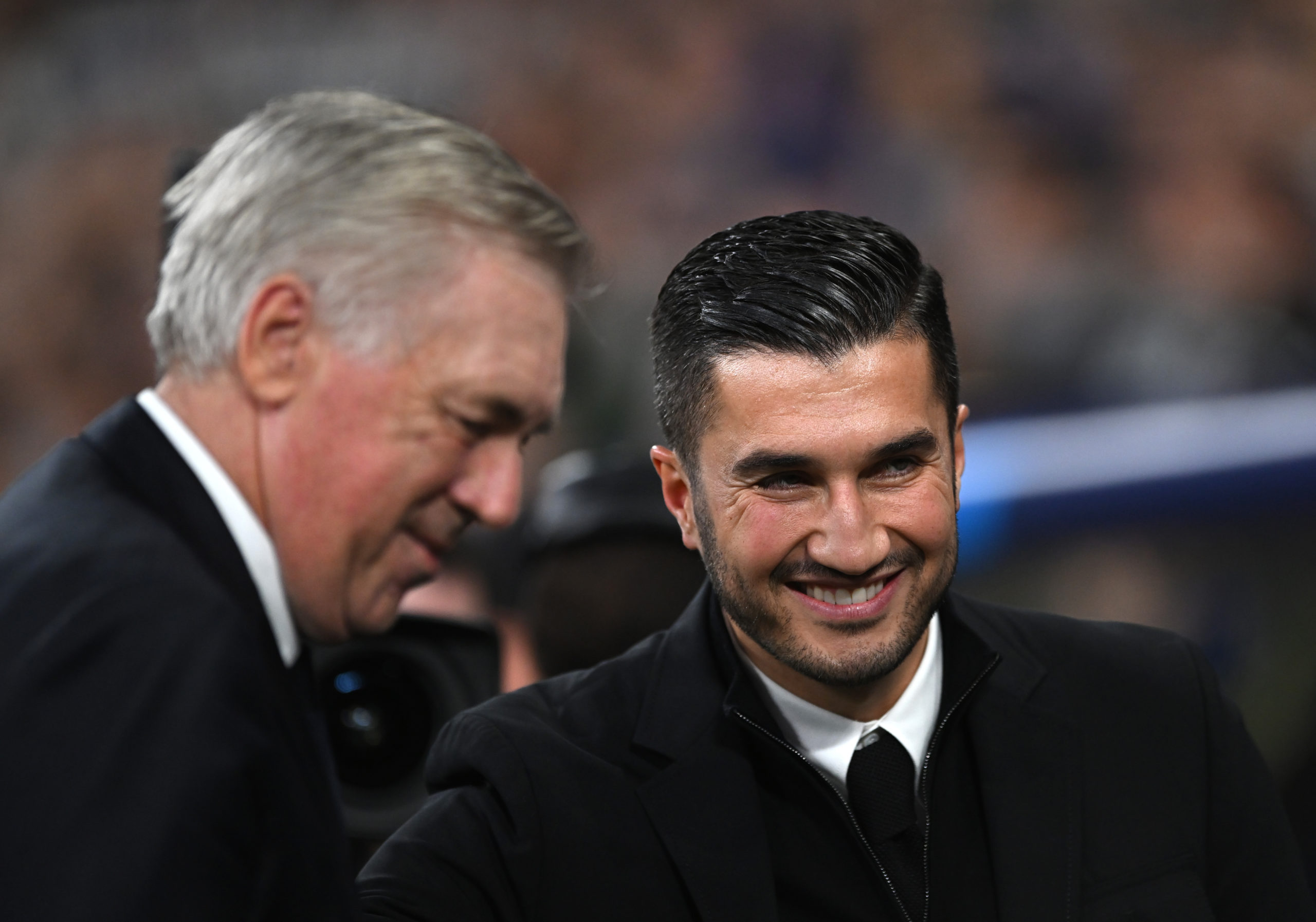 MADRID, SPAIN - OCTOBER 22: Carlo Ancelotti, Head Coach of Real Madrid, and Nuri Sahin, Head Coach of Borussia Dortmund, interact prior to kick-off ahead of the UEFA Champions League 2024/25 League Phase MD3 match between Real Madrid C.F. and Borussia Dortmund at Estadio Santiago Bernabeu on October 22, 2024 in Madrid, Spain. (Photo by Denis Doyle/Getty Images)