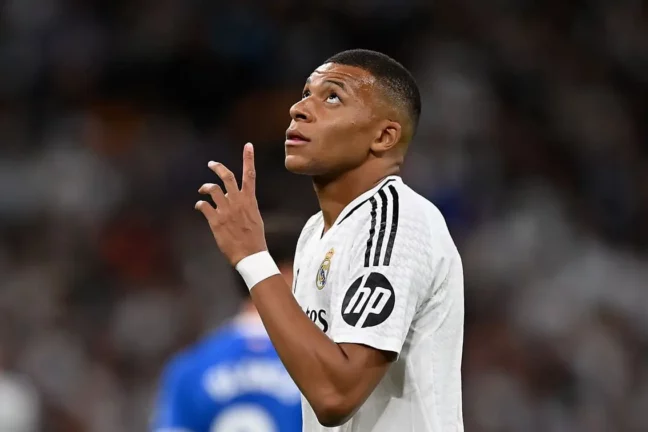 MADRID, SPAIN - SEPTEMBER 24: Kylian Mbappe of Real Madrid reacts during the LaLiga match between Real Madrid CF and Deportivo Alaves at Estadio Santiago Bernabeu on September 24, 2024 in Madrid, Spain. (Photo by Denis Doyle/Getty Images).