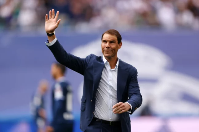 MADRID, SPAIN - APRIL 30: Tennis player Rafael Nadal acknowledges the fans after taking the honorary kick-off prior to the LaLiga Santander match between Real Madrid CF and RCD Espanyol at Estadio Santiago Bernabeu on April 30, 2022 in Madrid, Spain. (Photo by Gonzalo Arroyo Moreno/Getty Images)