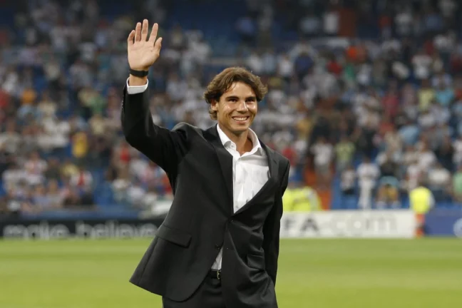 MADRID, SPAIN - SEPTEMBER 15: Tennis player Rafael Nadal greets prior to the start of the UEFA Champions League group G match between Real Madrid and AFC Ajax at Estadio Santiago Bernabeu on September 15, 2010 in Madrid, Spain. (Photo by Angel Martinez/Getty Images)