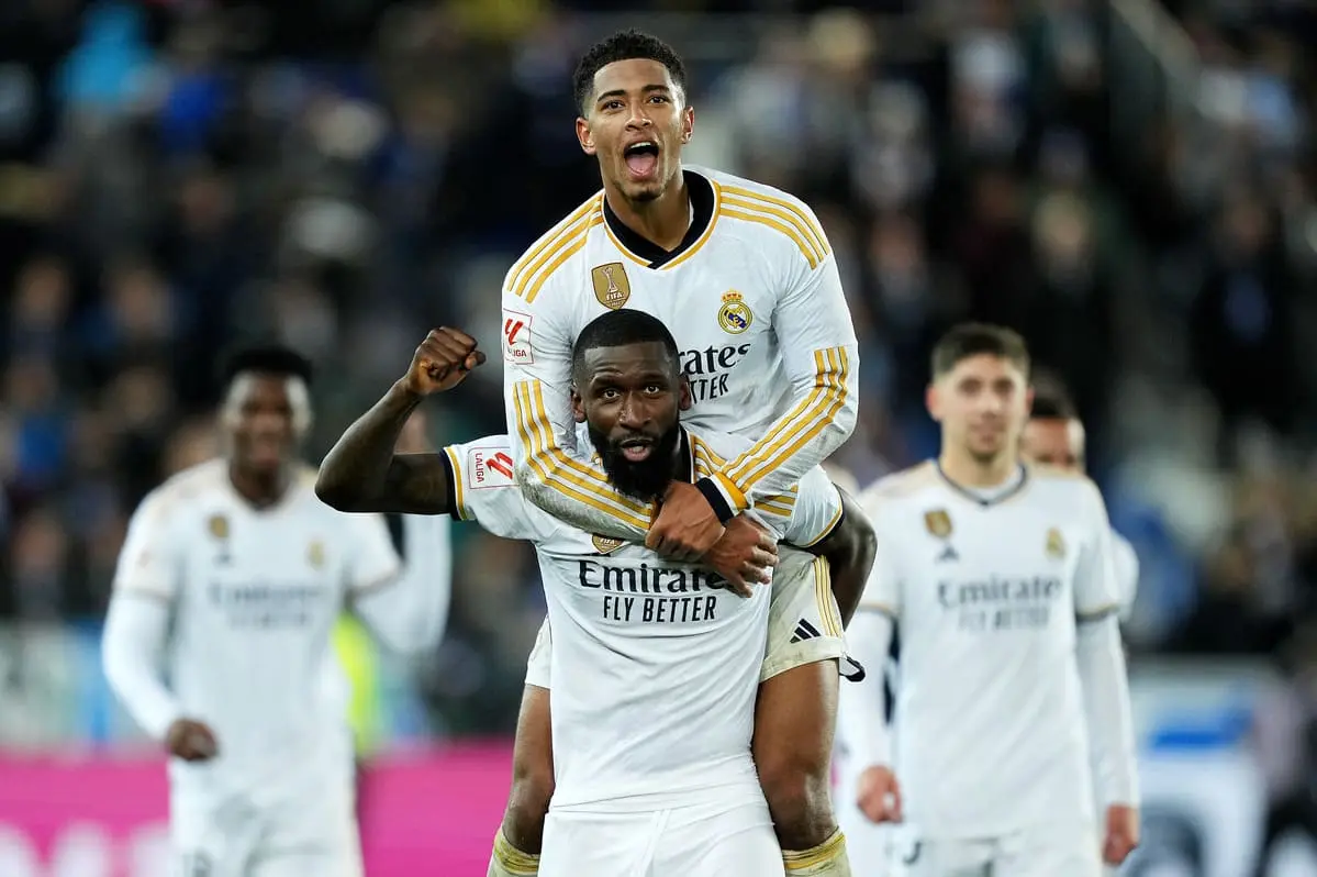 VITORIA-GASTEIZ, SPAIN - DECEMBER 21: Jude Bellingham and Antonio Ruediger of Real Madrid celebrate after the team's victory in the LaLiga EA Sports match between Deportivo Alaves and Real Madrid CF at Estadio de Mendizorroza on December 21, 2023 in Vitoria-Gasteiz, Spain. (Photo by Juan Manuel Serrano Arce/Getty Images).