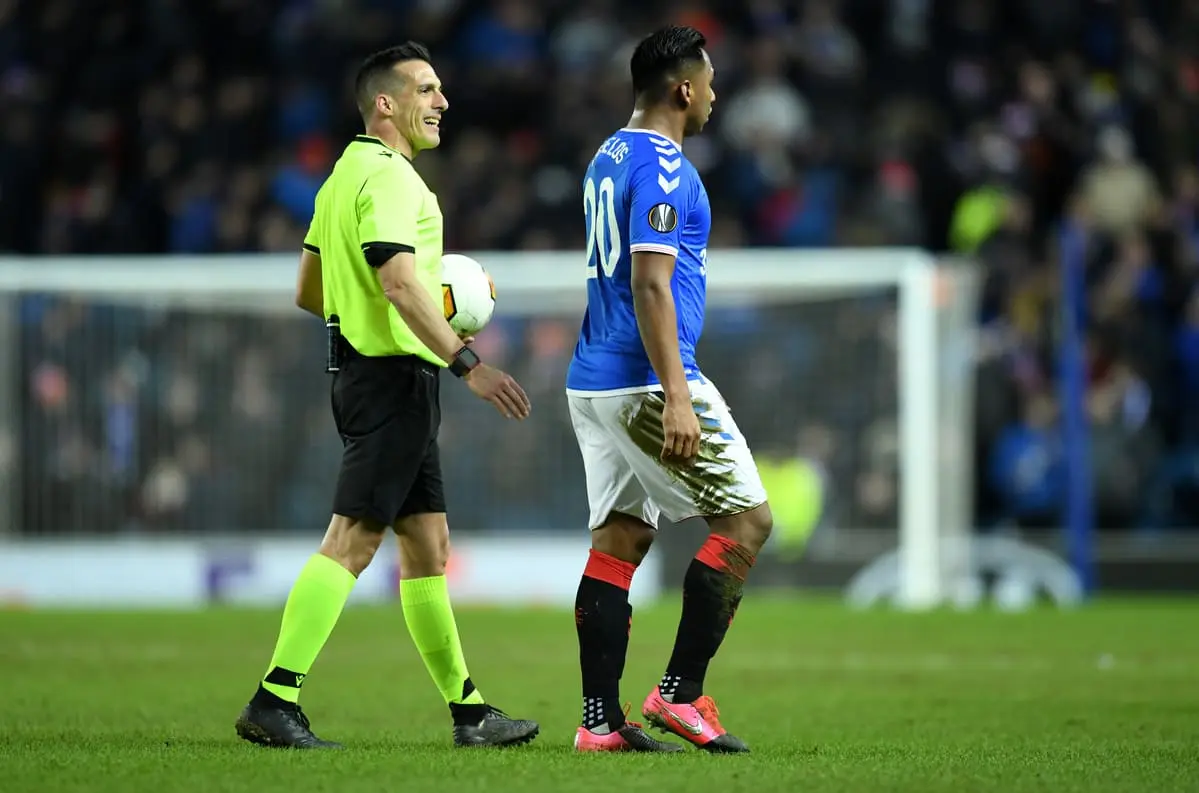 GLASGOW, SCOTLAND - FEBRUARY 20: Referee Xavier Estrada Fernández talks to Alfredo Morelos of Rangers FC during the UEFA Europa League round of 32 first leg match between Rangers FC and Sporting Braga at Ibrox Stadium on February 20, 2020 in Glasgow, United Kingdom. (Photo by Mark Runnacles/Getty Images) RFEF