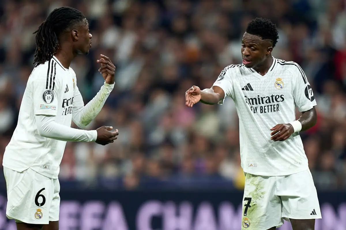 MADRID, SPAIN - NOVEMBER 05: Vinicius Junior and Eduardo Camavinga of Real Madrid interact during the UEFA Champions League 2024/25 League Phase MD4 match between Real Madrid C.F. and AC Milan at Estadio Santiago Bernabeu on November 05, 2024 in Madrid, Spain. (Photo by Angel Martinez/Getty Images).