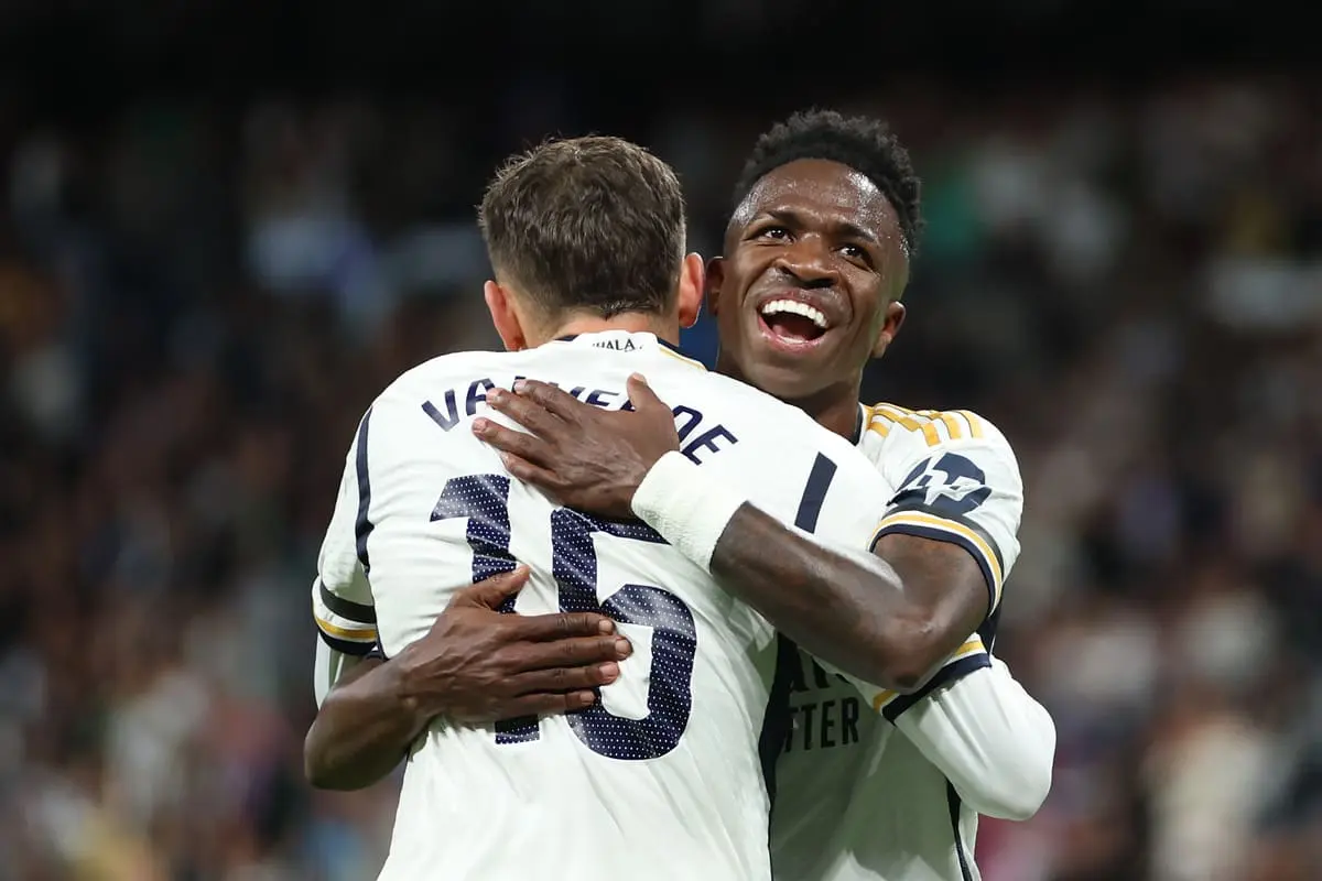 MADRID, SPAIN - MAY 14: Vinicius Junior of Real Madrid celebrates with Federico Valverde of Real Madrid after he scores the teams third goal during the LaLiga EA Sports match between Real Madrid CF and Deportivo Alaves at Estadio Santiago Bernabeu on May 14, 2024 in Madrid, Spain. (Photo by Clive Brunskill/Getty Images).