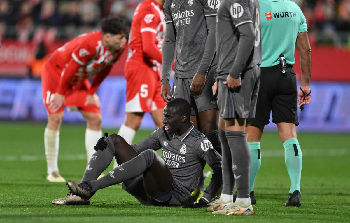 GIRONA, SPAIN - DECEMBER 07: Ferland Mendy of Real Madrid reacts after picking up an injury, before leaving the pitch following medical treatment, during the LaLiga match between Girona FC and Real Madrid CF at Montilivi Stadium on December 07, 2024 in Girona, Spain. (Photo by David Ramos/Getty Images)