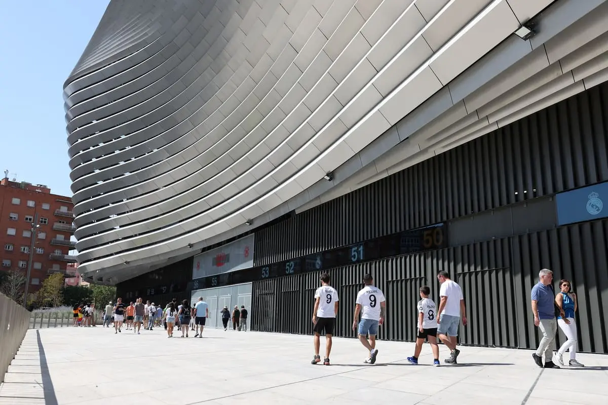 MADRID, SPAIN - AUGUST 25: A general view outside the stadium as fans arrive whilst wearing Real Madrid match shirts featuring the name of 'Mbappe - 9' on the back, prior to the La Liga match between Real Madrid CF and Real Valladolid CF at Estadio Santiago Bernabeu on August 25, 2024 in Madrid, Spain. (Photo by Florencia Tan Jun/Getty Images)