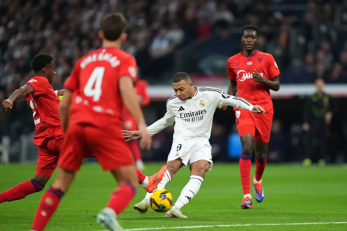 MADRID, SPAIN - DECEMBER 22: Kylian Mbappe of Real Madrid scores his team's first goal during the LaLiga match between Real Madrid CF and Sevilla FC at Estadio Santiago Bernabeu on December 22, 2024 in Madrid, Spain. (Photo by Angel Martinez/Getty Images)