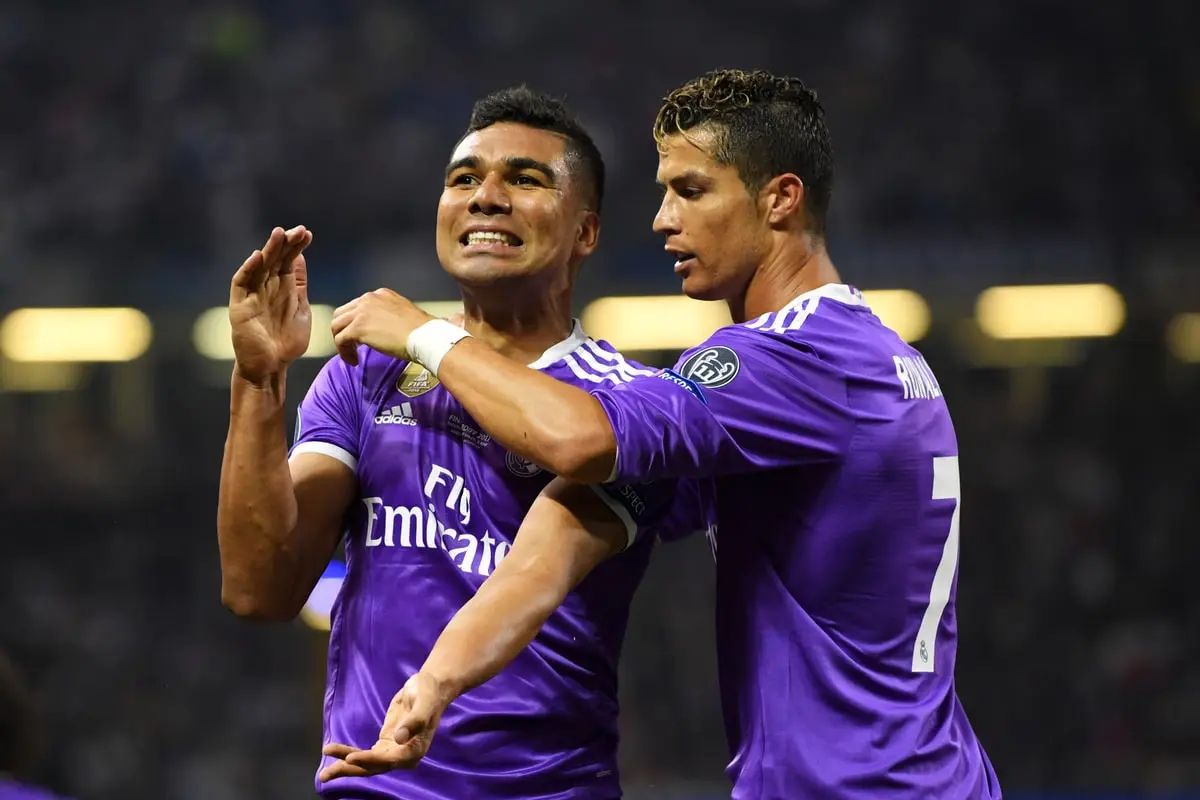CARDIFF, WALES - JUNE 03: Casemiro of Real Madrid celebrates scoring his sides second goal with Cristiano Ronaldo of Real Madrid during the UEFA Champions League Final between Juventus and Real Madrid at National Stadium of Wales on June 3, 2017 in Cardiff, Wales. (Photo by Matthias Hangst/Getty Images)