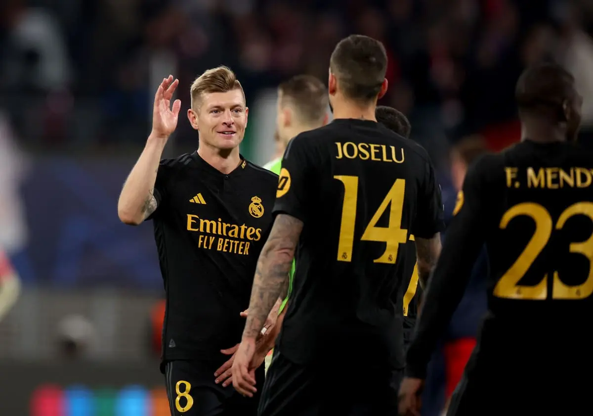 LEIPZIG, GERMANY - FEBRUARY 13: Toni Kroos and Joselu of Real Madrid celebrate victory at full-time following thhe UEFA Champions League 2023/24 round of 16 first leg match between RB Leipzig and Real Madrid CF at Red Bull Arena on February 13, 2024 in Leipzig, Germany. (Photo by Alexander Hassenstein/Getty Images)