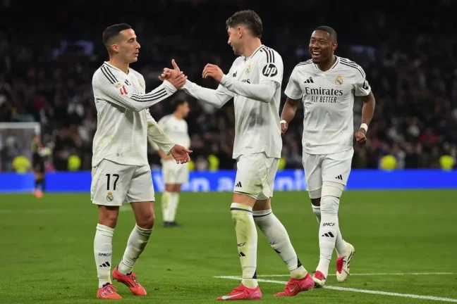 MADRID, SPAIN - JANUARY 19: Federico Valverde of Real Madrid celebrates with teammates Lucas Vazquez (L) and David Alaba after scoring a goal that was later disallowed by VAR during the LaLiga match between Real Madrid CF and UD Las Palmas at Estadio Santiago Bernabeu on January 19, 2025 in Madrid, Spain. (Photo by Denis Doyle/Getty Images).