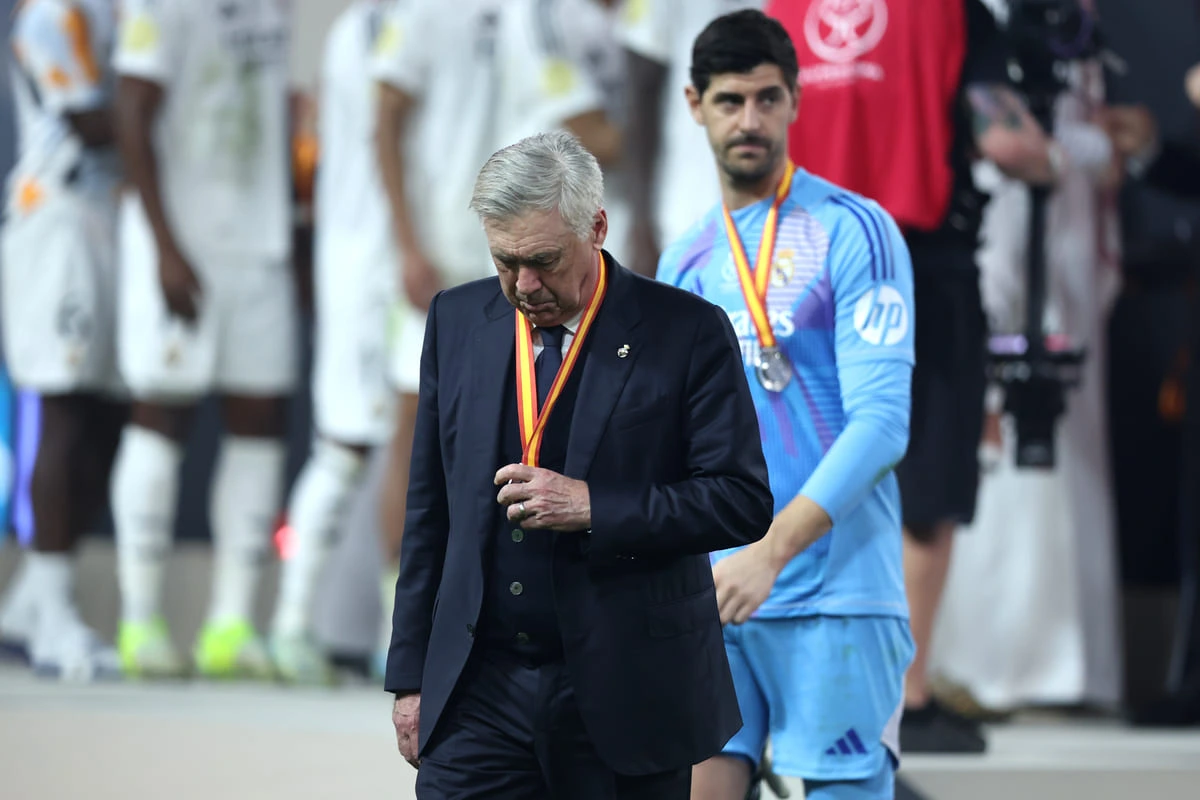 JEDDAH, SAUDI ARABIA - JANUARY 12: Carlo Ancelotti, Head Coach of Real Madrid, reacts with his Supercopa de Espana runners up medal during the trophy presentation following the Spanish Super Cup Final between Real Madrid and FC Barcelona at King Abdullah Sports City on January 12, 2025 in Jeddah, Saudi Arabia. (Photo by Yasser Bakhsh/Getty Images)