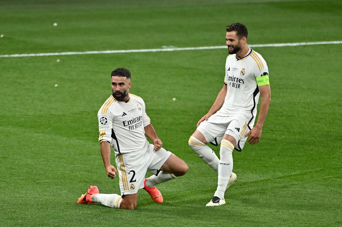 LONDON, ENGLAND - JUNE 01: Daniel Carvajal of Real Madrid celebrates scoring his team's first goal with teammate Nacho Fernandez during the UEFA Champions League 2023/24 Final match between Borussia Dortmund and Real Madrid CF at Wembley Stadium on June 01, 2024 in London, England. (Photo by Dan Mullan/Getty Images)