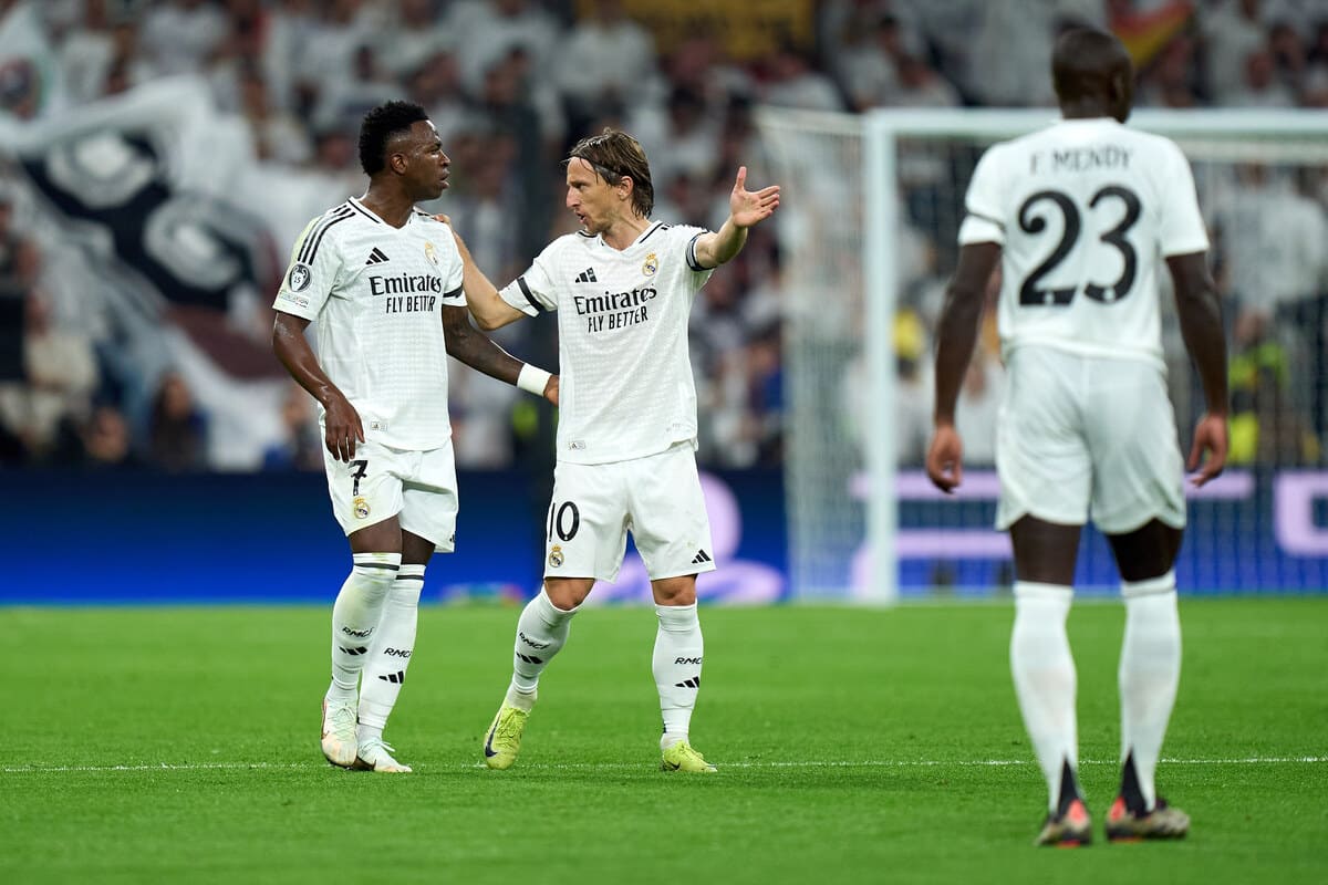 MADRID, SPAIN - NOVEMBER 05: Vinicius Junior and Luka Modric of Real Madrid interact during the UEFA Champions League 2024/25 League Phase MD4 match between Real Madrid C.F. and AC Milan at Estadio Santiago Bernabeu on November 05, 2024 in Madrid, Spain. (Photo by Angel Martinez/Getty Images)