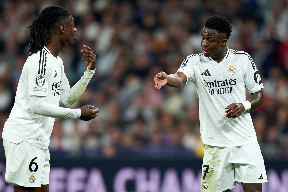MADRID, SPAIN - NOVEMBER 05: Vinicius Junior and Eduardo Camavinga of Real Madrid interact during the UEFA Champions League 2024/25 League Phase MD4 match between Real Madrid C.F. and AC Milan at Estadio Santiago Bernabeu on November 05, 2024 in Madrid, Spain. (Photo by Angel Martinez/Getty Images)