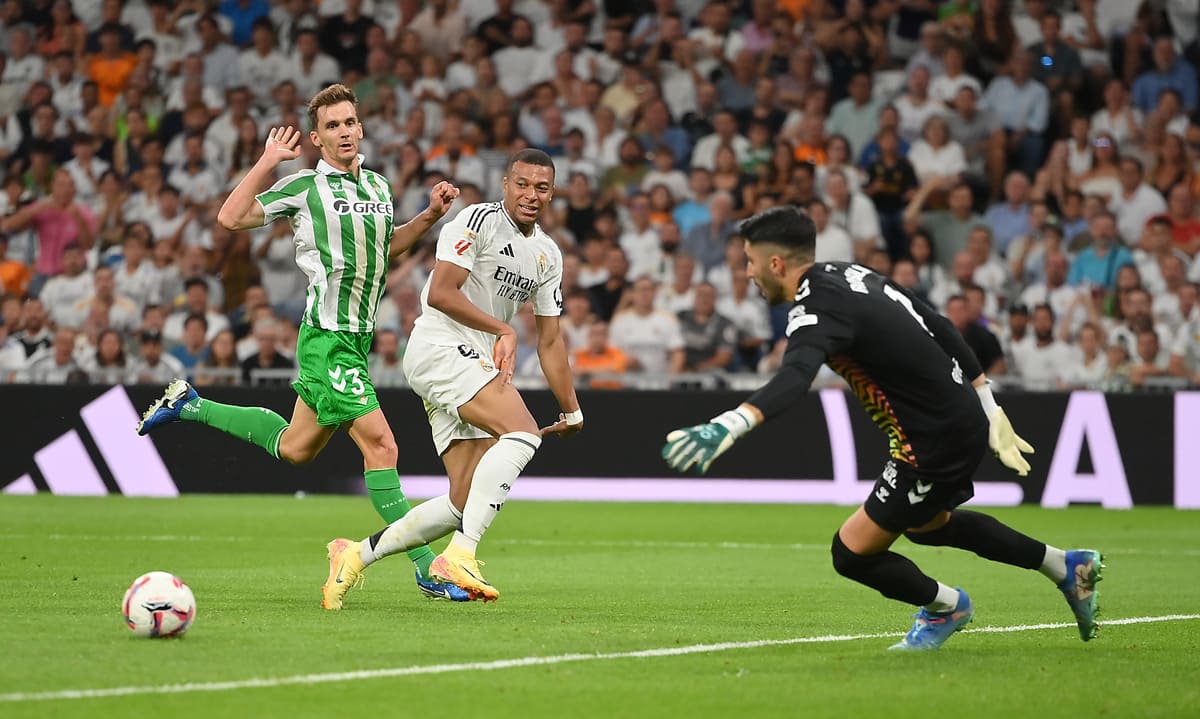 MADRID, SPAIN - SEPTEMBER 01: Kylian Mbappe of Real Madrid passes thje ball during the LaLiga match between Real Madrid CF and Real Betis Balompie at Estadio Santiago Bernabeu on September 01, 2024 in Madrid, Spain. (Photo by Denis Doyle/Getty Images)