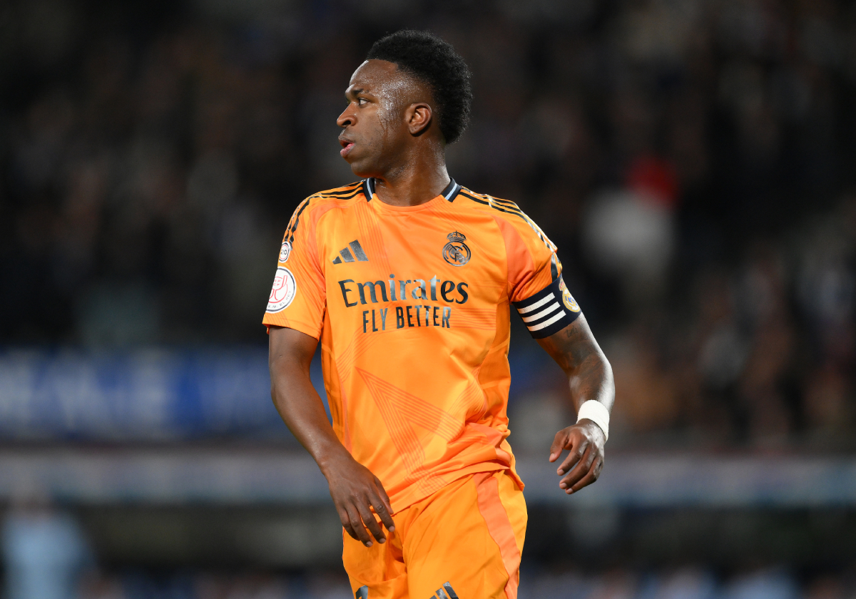 SAN SEBASTIAN, SPAIN - FEBRUARY 26: Vinicius Junior of Real Madrid looks on as he wears the captain's armband during the Copa del Rey Semi Final match between Real Sociedad and Real Madrid at Reale Arena on February 26, 2025 in San Sebastian, Spain. (Photo by David Ramos/Getty Images)