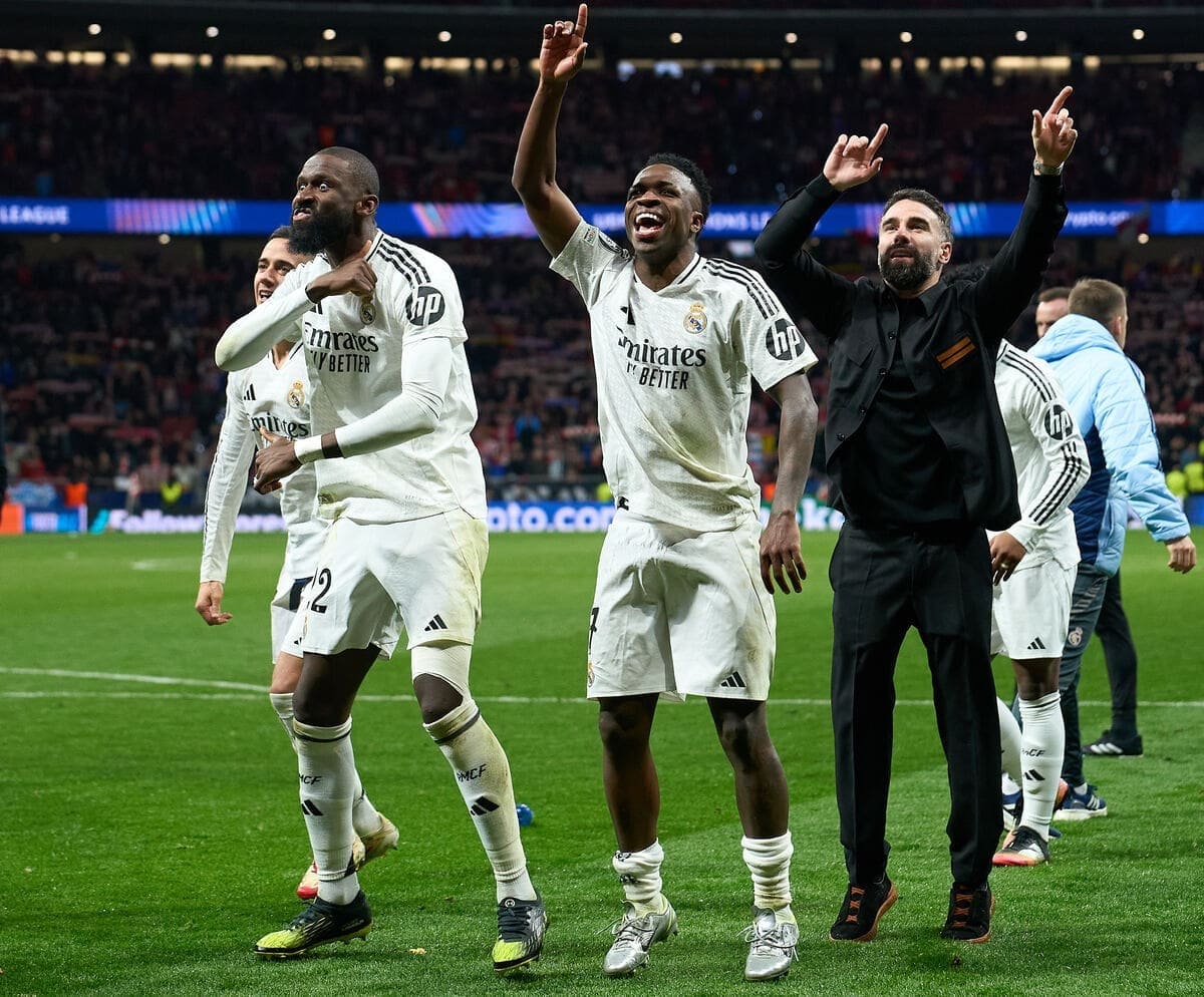 MADRID, SPAIN - MARCH 12: Antonio Ruediger, Vinicius Junior and Daniel Carvajal of Real Madrid celebrate victory after Real Madrid defeat Atletico de Madrid in the penalty shoot out during the UEFA Champions League 2024/25 UEFA Champions League 2024/25 Round of 16 second leg match between Atletico de Madrid and Real Madrid C.F. at Riyadh Air Metropolitano on March 12, 2025 in Madrid, Spain. (Photo by Angel Martinez/Getty Images)