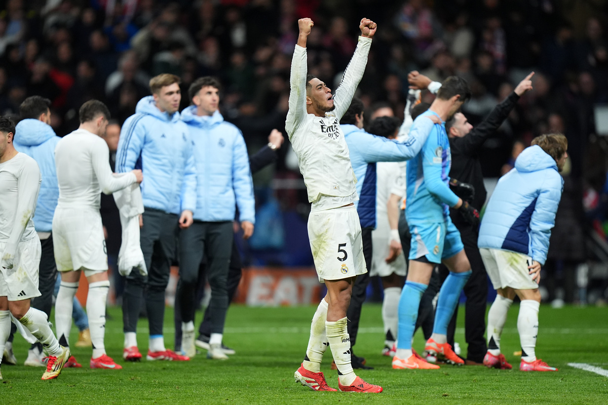 MADRID, SPAIN - MARCH 12: Jude Bellingham of Real Madrid celebrates victory after Real Madrid defeat Atletico de Madrid in the penalty shootout during the UEFA Champions League 2024/25 Round of 16 second leg match between Atletico de Madrid and Real Madrid C.F. at Estadio Metropolitano on March 12, 2025 in Madrid, Spain. (Photo by Angel Martinez/Getty Images)