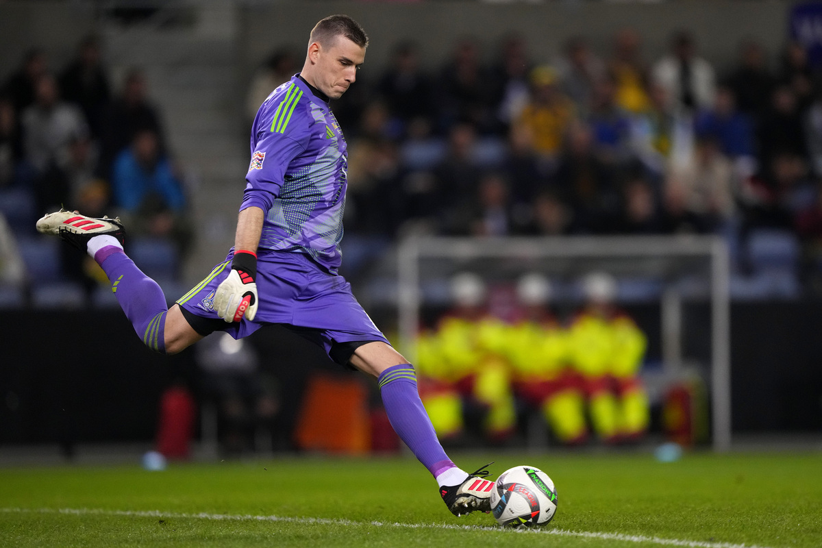 GENK, BELGIUM - MARCH 23: Andriy Lunin #1 of Ukraine kicks the ball in the first half of the UEFA Nations League 2024/25 League A/B Play-offs second leg match between Belgium and Ukraine on March 23, 2025 in Genk, Belgium. (Photo by Alex Bierens de Haan/Getty Images)