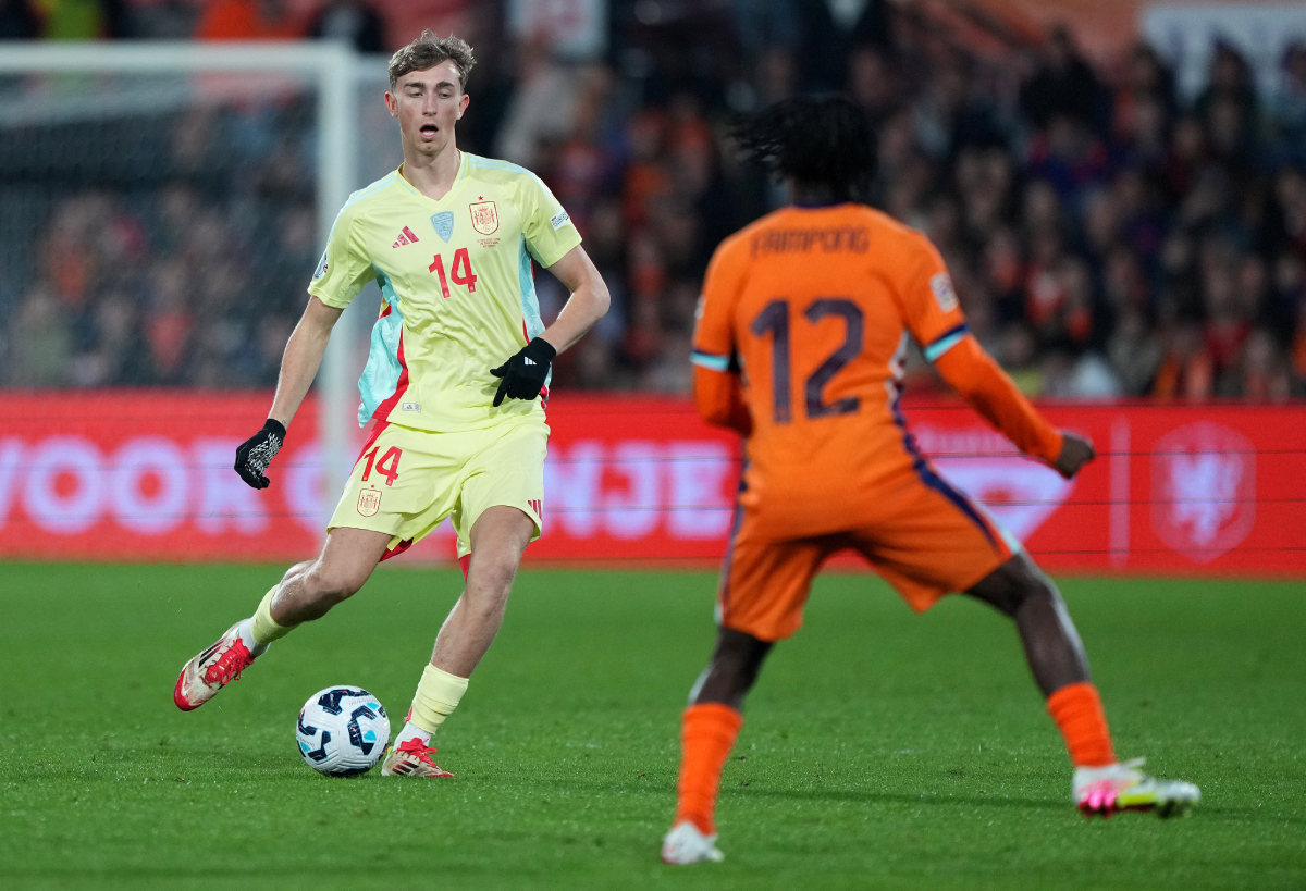 ROTTERDAM, NETHERLANDS - MARCH 20: Dean Huijsen #14 of Spain dribbles the ball in the second half of the UEFA Nations League quarterfinal leg one match between Netherlands and Spain at De Kuip on March 20, 2025 in Rotterdam, Netherlands. (Photo by Alex Bierens de Haan/Getty Images)