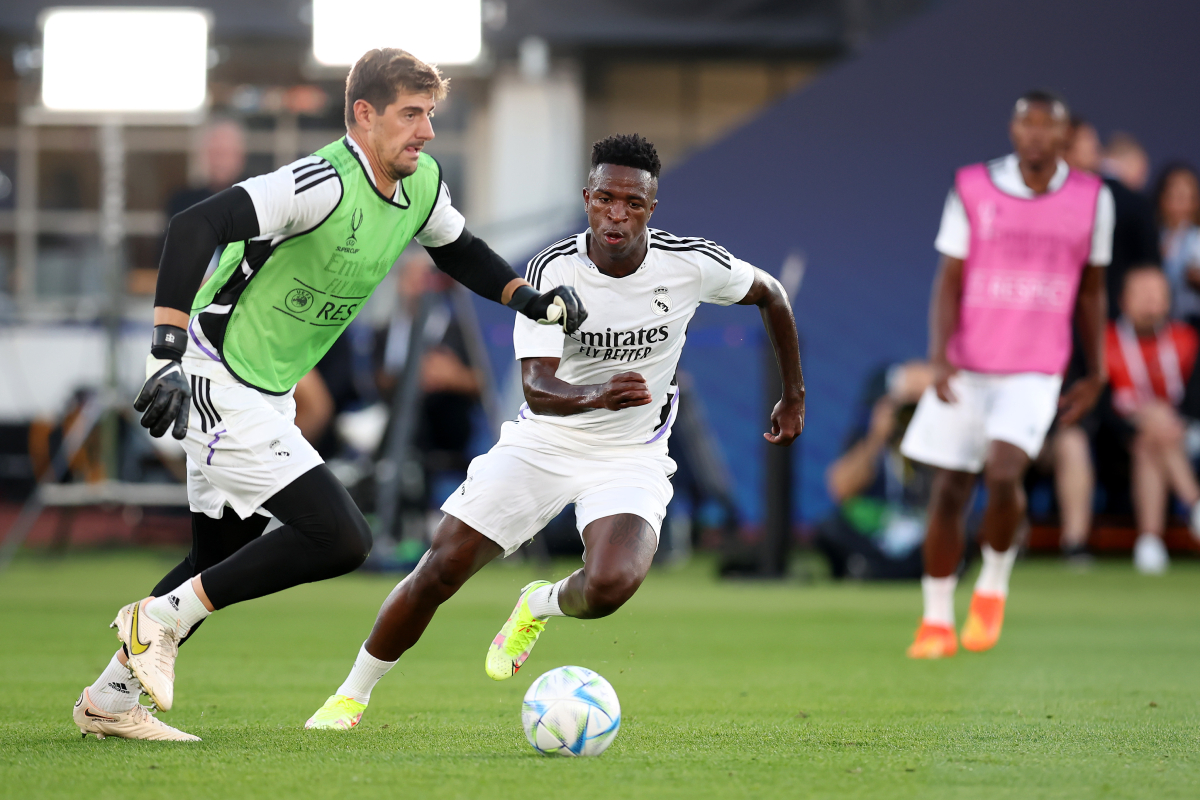 HELSINKI, FINLAND - AUGUST 09: Thibaut Courtois and Vinicius Junior of Real Madrid train during the Real Madrid CF training session and press conference ahead of the UEFA Super Cup Final 2022 at Helsinki Olympic Stadium on August 09, 2022 in Helsinki, Finland. (Photo by Alex Grimm/Getty Images )