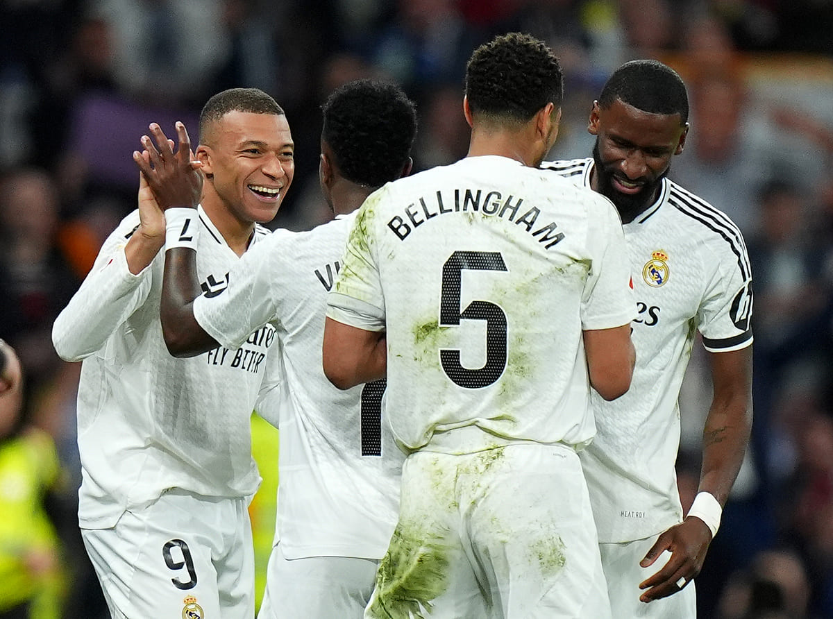 MADRID, SPAIN - MARCH 29: Kylian Mbappe of Real Madrid celebrates scoring his team's third goal with Vinicius Junior, Jude Bellingham and Antonio Ruediger during the LaLiga match between Real Madrid CF and CD Leganes at Estadio Santiago Bernabeu on March 29, 2025 in Madrid, Spain. (Photo by Angel Martinez/Getty Images)