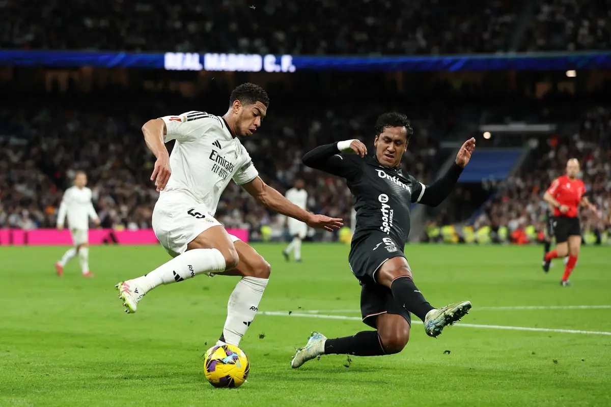 MADRID, SPAIN - MARCH 29: Jude Bellingham of Real Madrid is challenged by Renato Tapia of CD Leganes during the LaLiga match between Real Madrid CF and CD Leganes at Estadio Santiago Bernabeu on March 29, 2025 in Madrid, Spain. (Photo by Florencia Tan Jun/Getty Images) MADRID, SPAIN - MARCH 29: Jude Bellingham of Real Madrid is challenged by Renato Tapia of CD Leganes during the LaLiga match between Real Madrid CF and CD Leganes at Estadio Santiago Bernabeu on March 29, 2025 in Madrid, Spain. (Photo by Florencia Tan Jun/Getty Images)