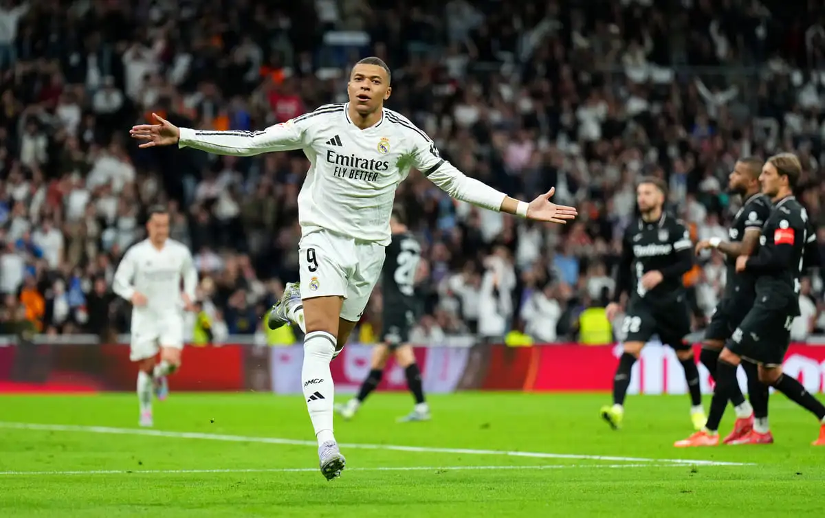 MADRID, SPAIN - MARCH 29: Kylian Mbappe of Real Madrid celebrates scoring his team's first goal from the penalty spot during the LaLiga match between Real Madrid CF and CD Leganes at Estadio Santiago Bernabeu on March 29, 2025 in Madrid, Spain. (Photo by Angel Martinez/Getty Images).